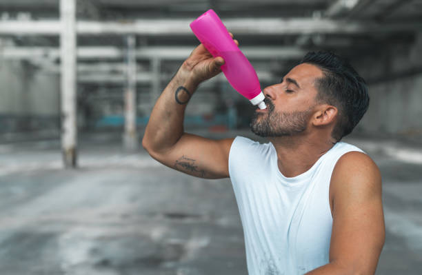 istock Athletic Man Resting after Exercising in an Abandoned Warehouse 970367024