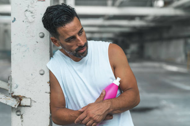 istock Athletic Man Resting after Exercising in an Abandoned Warehouse 970367038