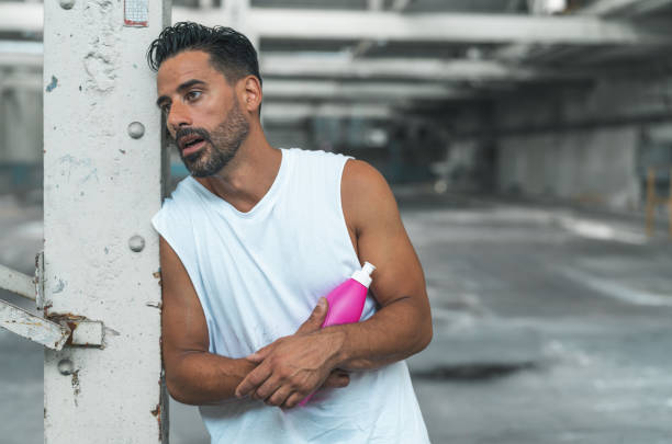 istock Athletic Man Resting after Exercising in an Abandoned Warehouse 970367052
