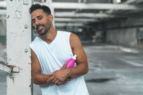 istock Athletic Man Resting after Exercising in an Abandoned Warehouse 970367054