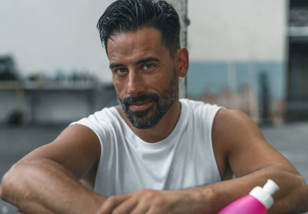istock Athletic Man Resting after Exercising in an Abandoned Warehouse 970367080