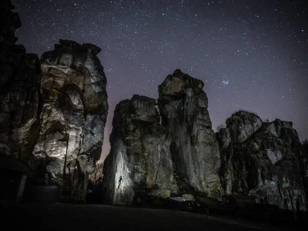 Climbing session at night on the Externsteine in the Teutoburg Forest