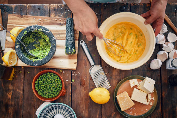 istock Preparing Frittata with Green Asparagus, Peas and Parmesan 970370206