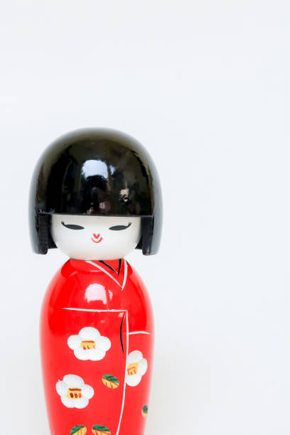 istock Japanese Wooden Doll Wearing A Red Kimono 970370564