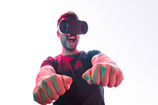 istock Cheerful man in VR glasses gaming 970375276