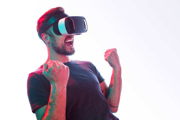 istock Excited man in VR glasses celebrating win 970375316