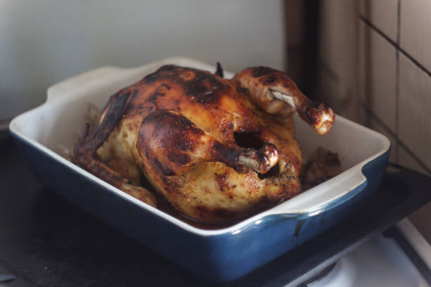istock appetizing baked chicken with golden roasted crust cooked in the oven 970379750