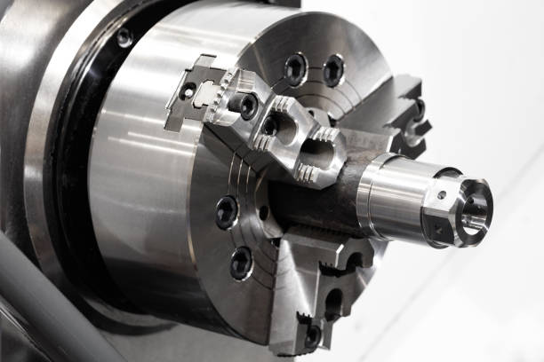 istock CNC lathe machine or Turning machine with rotating spindle with metal part  industrial engineering concept. 970380462