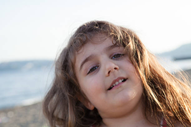 istock Little Girl Portrait at Beach 970384550