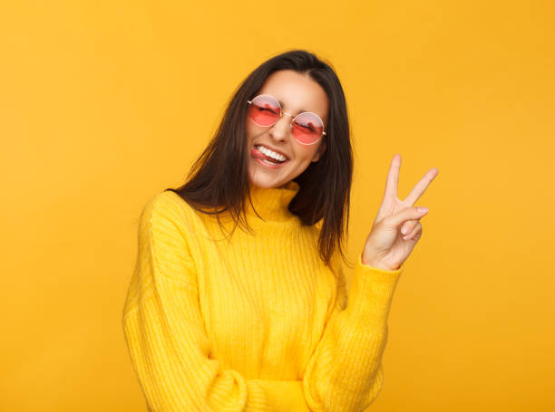 istock Stylish hipster girl showing two fingers 970385202