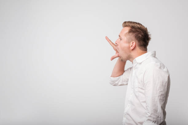 istock Caucasian man making bla bla sign with his hand. Empty promises. 970387822