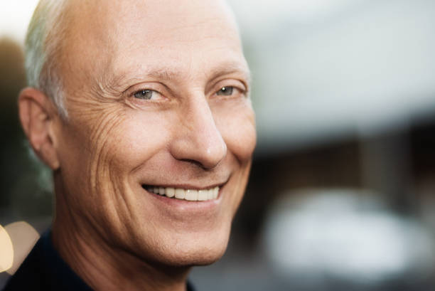 istock Handsome mature man smiles cheerfully 970388090