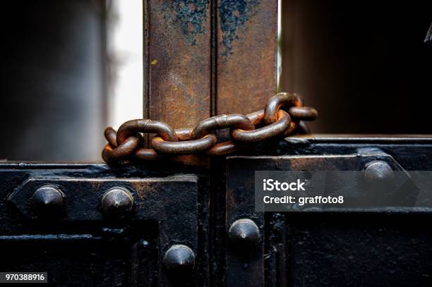 Old Metal Gates Are Covered With A Rusty Metal Chain Stock Photo - Download Image Now