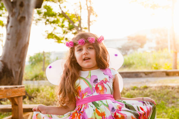 istock Little Girl Playing at Sunset 970389120