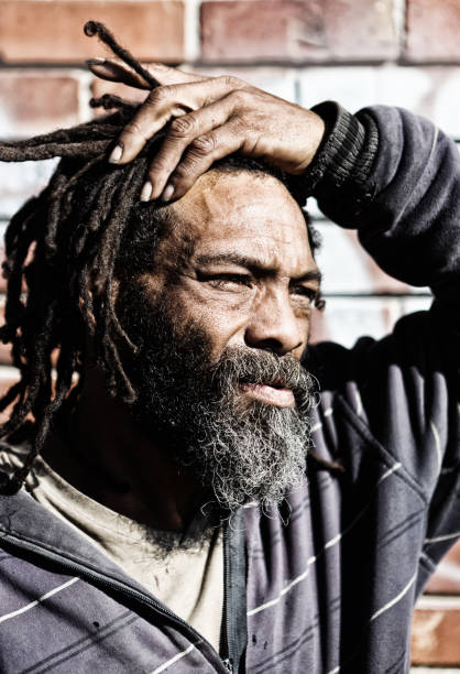 istock Anxious homeless man contemplates his future 970395512