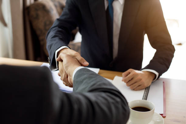 istock Business handshake. Two businessman shaking hands in office 970395616