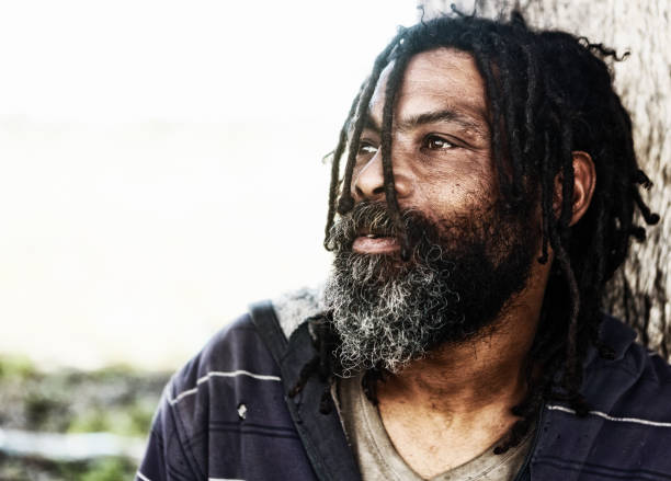 istock Homeless man, deep in thought, looks out to the side 970398252