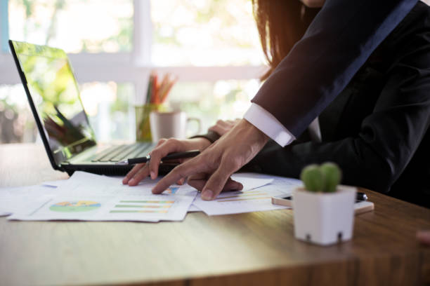 istock businessman working with new startup project and analyze charts and graphs showing the results of their successful. 970399582