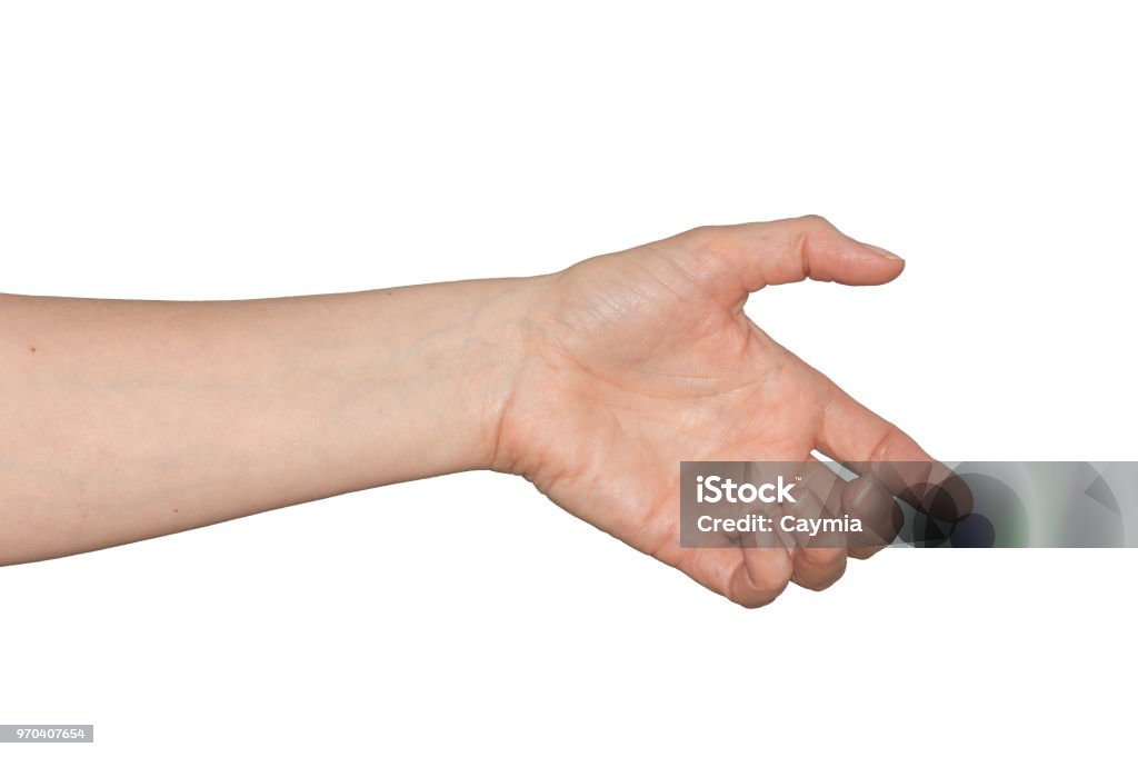 Caucasian woman's empty hand as if holding something. Isolated. Caucasian woman's empty hand as if holding something. Palm facing forward fingers curled. Isolated on white. Left Handed Stock Photo