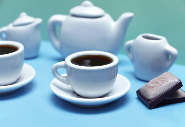 istock tea set with cups of tea and chocolate 970409044
