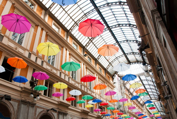 Genoa, Galleria Mazzini decorated with colored umbrellas hanging from its ceiling (event: Euroflora 2018)