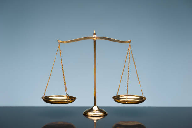 istock Golden brass balance or imbalance scale 970415990