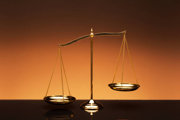 istock Golden brass balance or imbalance scale 970416014