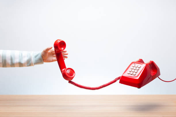 istock Woman reaching the red phone 970416046