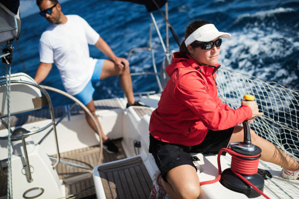 istock Attractive strong woman sailing with her boat 970417282