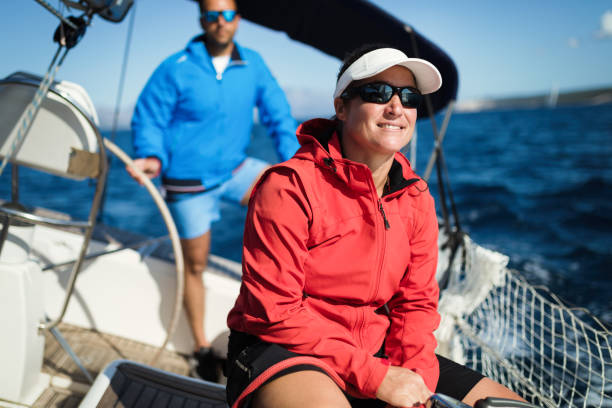 istock Attractive strong woman sailing with her boat 970417328