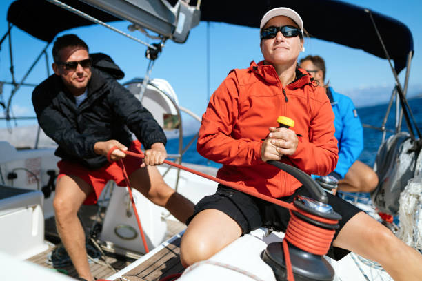istock Attractive strong woman sailing with her boat 970417362