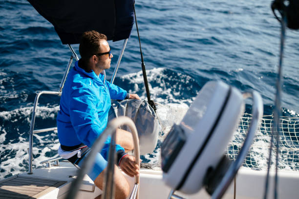 istock Handsome strong man sailing with his boat 970417434