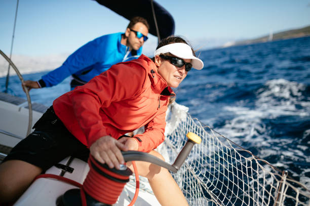 istock Attractive strong woman sailing with her boat 970417470