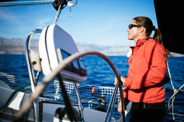 istock Attractive strong woman sailing with her boat 970417774