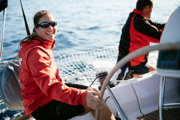 istock Attractive strong woman sailing with her boat 970417782