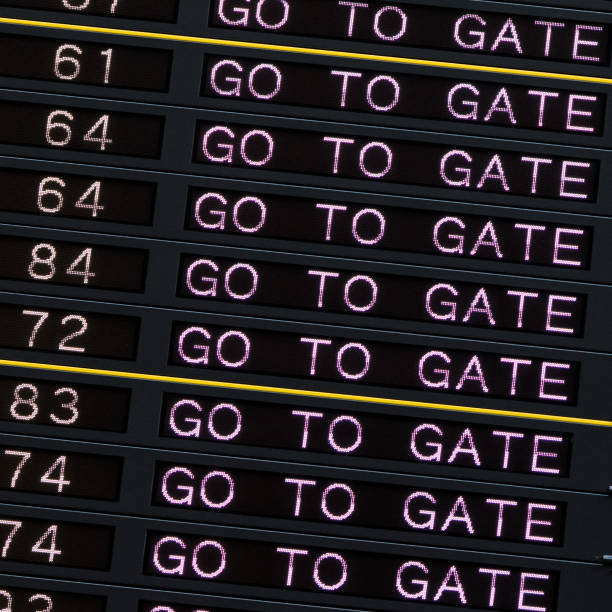 istock Airport departure board with go to gate sign. 970417802