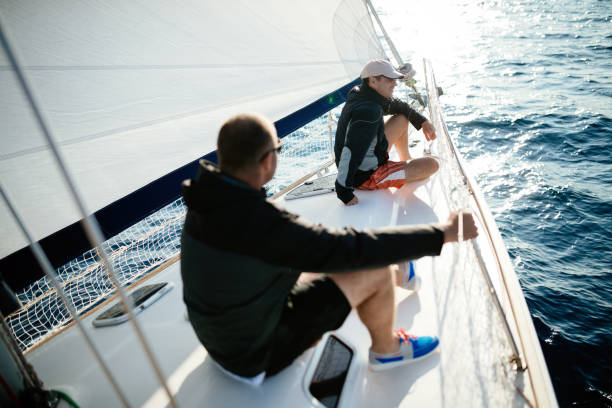 istock Handsome strong men sailing with their boat 970417830