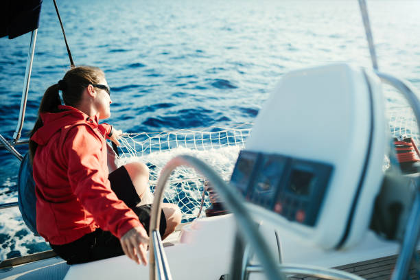 istock Attractive strong woman sailing with her boat 970417904