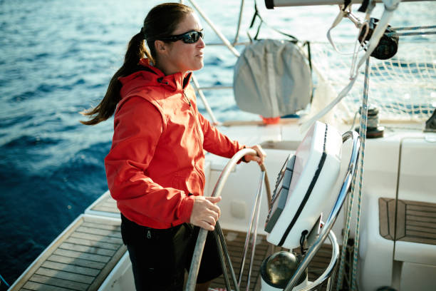 istock Attractive strong woman sailing with her boat 970417946