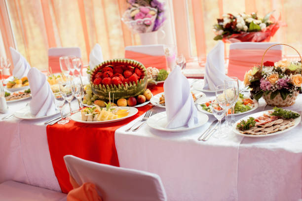 istock wedding tables in restairant, nobody at begining, red interior 970421278