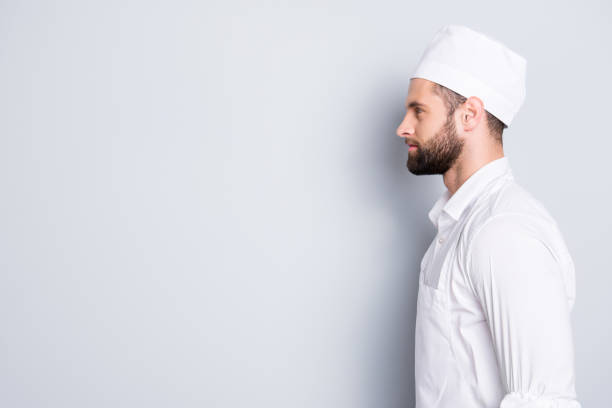 istock Profile side view portrait with copyspace, empty place for advertisement of attractive handsome butcher standing over grey background 970428382