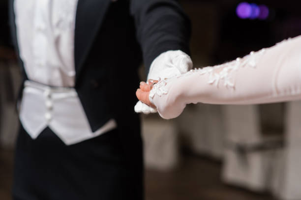 istock Couple hands dancing waltz at ball 970429726