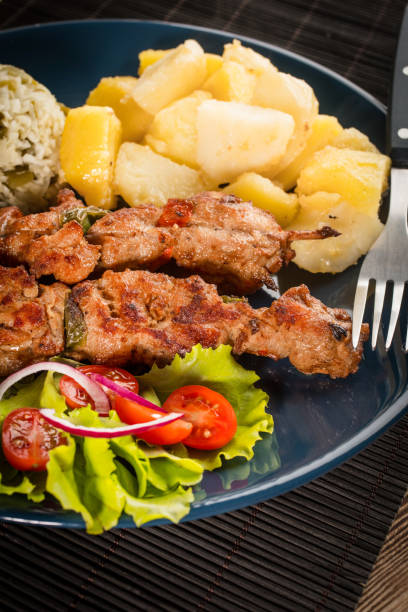 istock Shish kebabs - grilled meat and vegetables 970432568