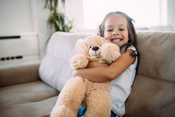 istock Young girl playing with her favourite toy 970433366