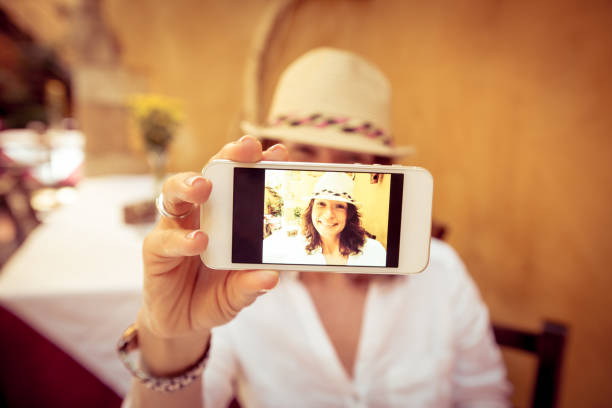 istock Young woman taking selfie 970433614