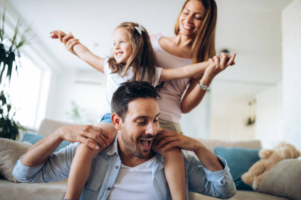 istock Happy family having fun time at home 970436426