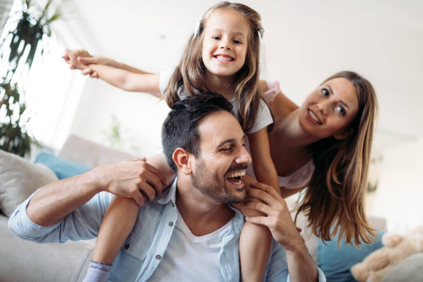istock Happy family having fun time at home 970436430