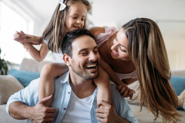 istock Happy family having fun time at home 970436540