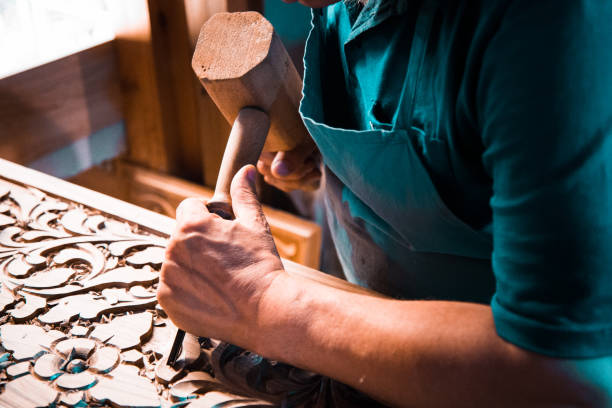 istock wood carving man's hands 970438458
