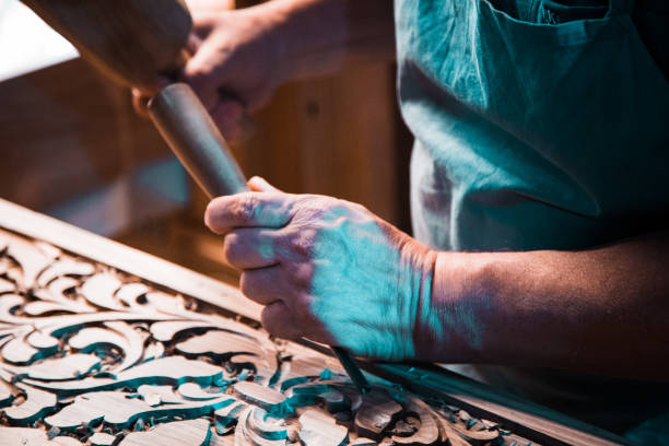 istock wood carving man's hands 970440756
